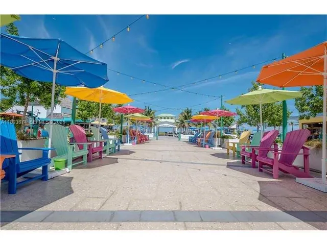 a view of an patio with a table and chairs