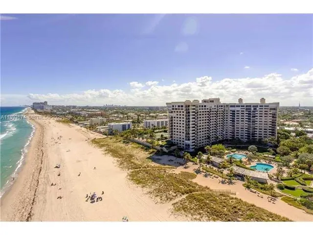 a view of a chairs and table in the patio