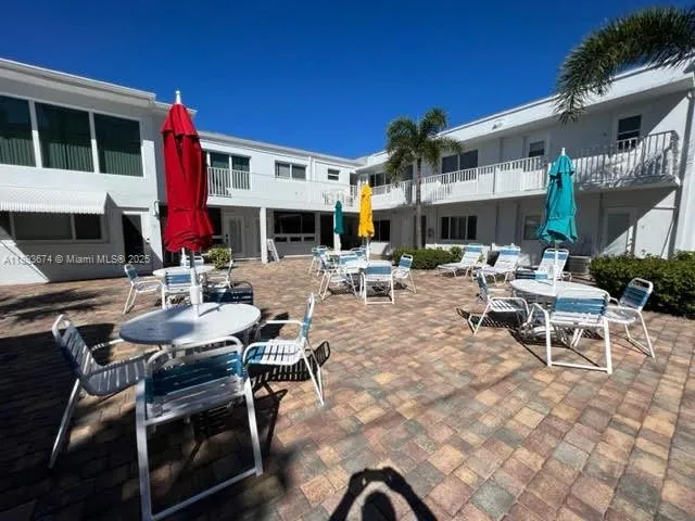 a view of swimming pool and deck in the backyard