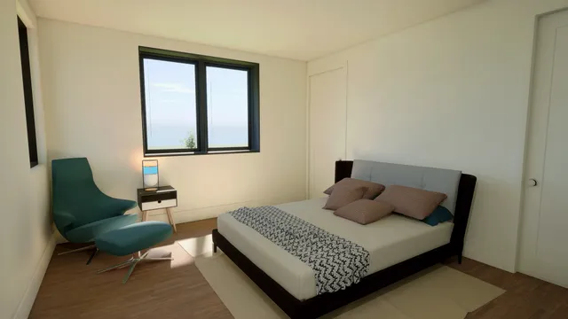 a bedroom with a bed window and couch