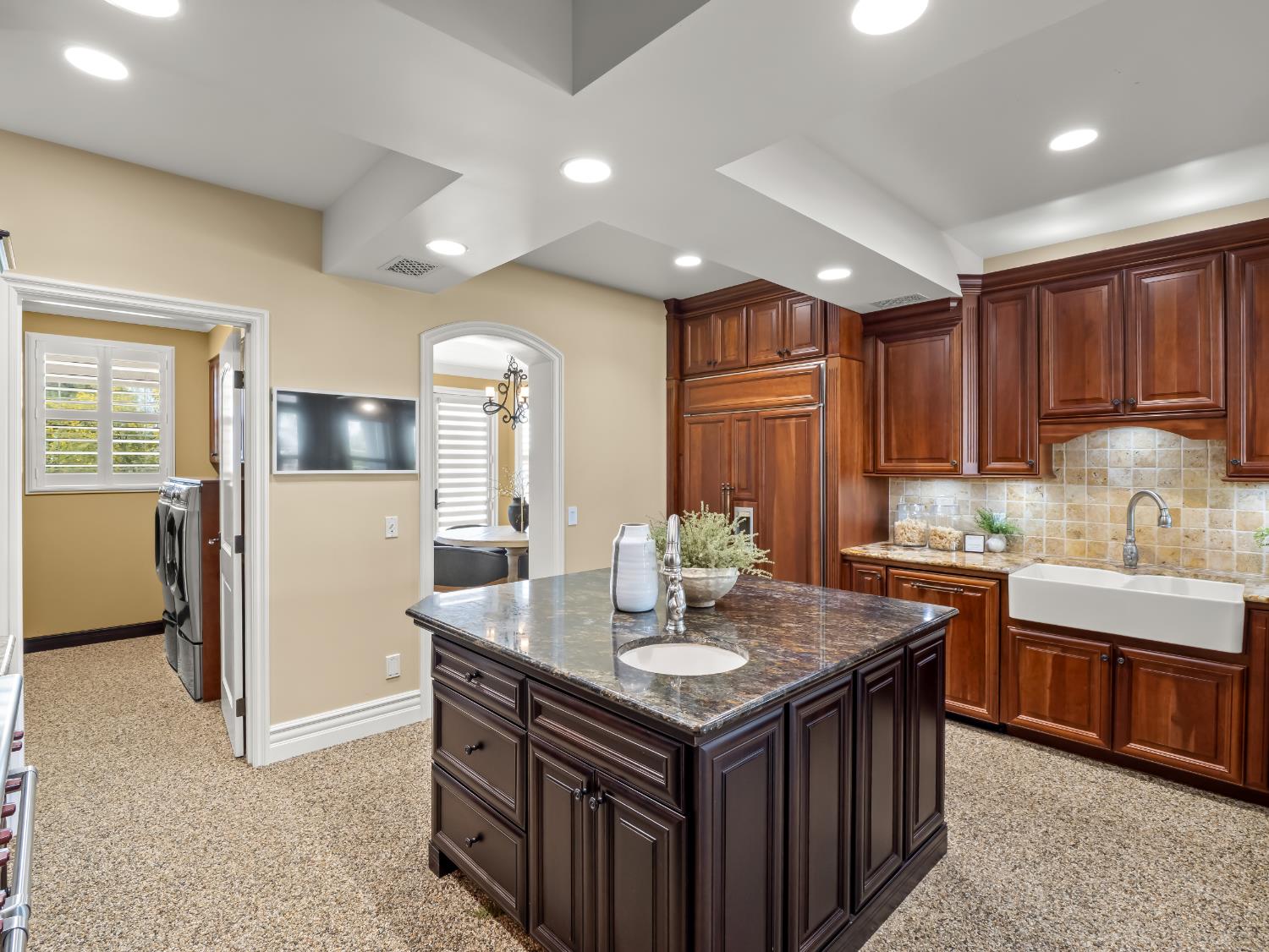 17113 Mark Road Madera, CA 93636 - Photo 25 of 99 a kitchen with granite countertop a sink and cabinets