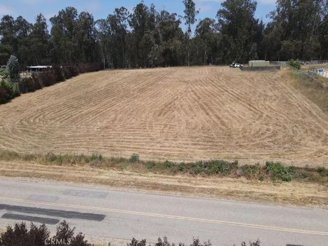 a view of a chairs and table in backyard
