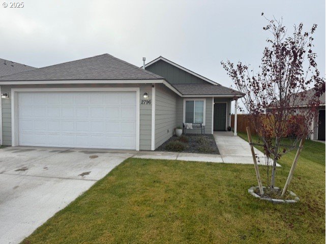 2796 High Desert Loop Umatilla, OR 97882 - Photo 1 of 19 a front view of a house with garden