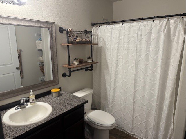 2796 High Desert Loop Umatilla, OR 97882 - Photo 12 of 19 a bathroom with a granite countertop sink toilet and a mirror