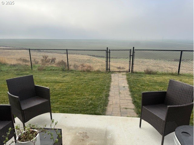 2796 High Desert Loop Umatilla, OR 97882 - Photo 17 of 19 a living room with a floor to ceiling window next to a yard