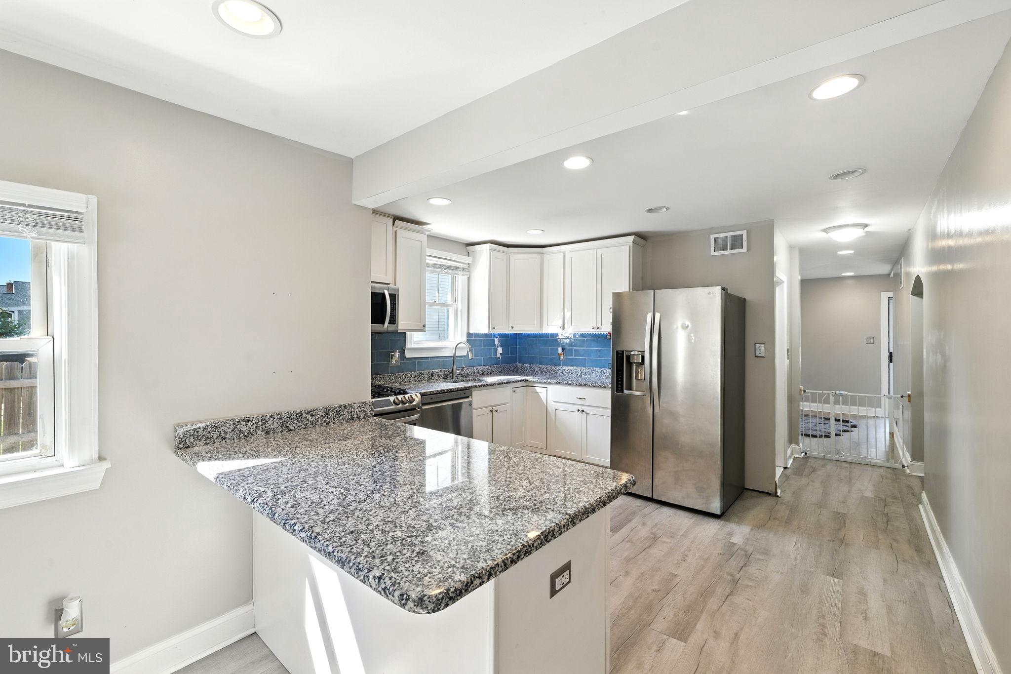 361 Savannah Road Baltimore, MD 21221 - Photo 11 of 30 a kitchen with stainless steel appliances granite countertop a refrigerator and a sink