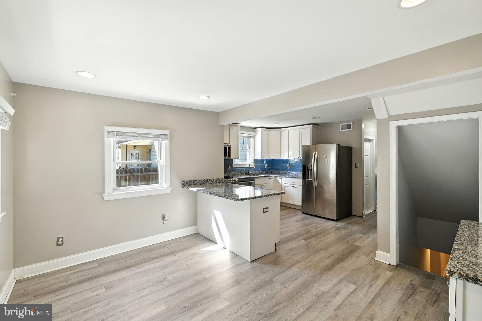 361 Savannah Road Baltimore, MD 21221 - Photo 15 of 30 a kitchen with cabinets and stainless steel appliances
