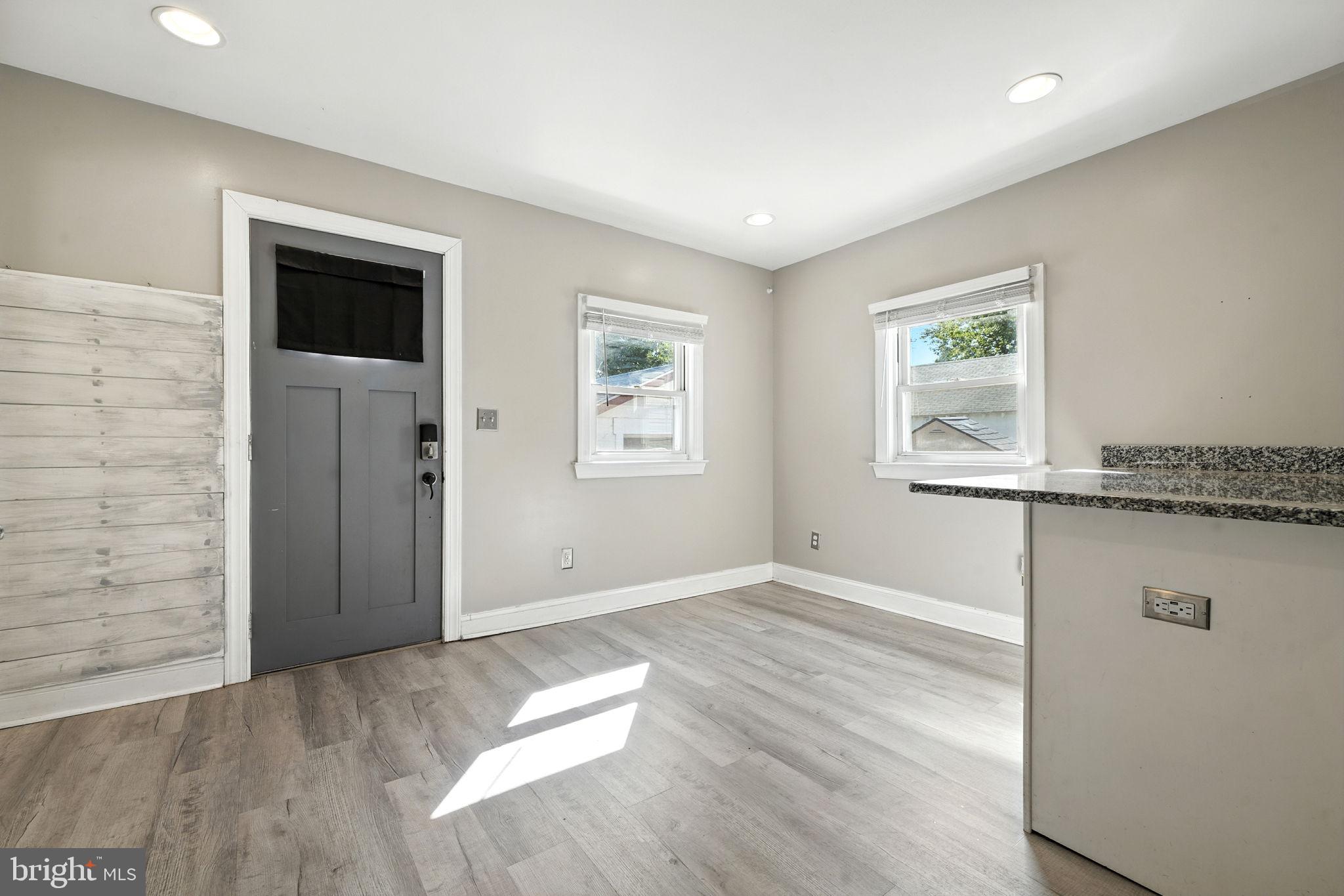 361 Savannah Road Baltimore, MD 21221 - Photo 16 of 30 an empty room with wooden floor and windows