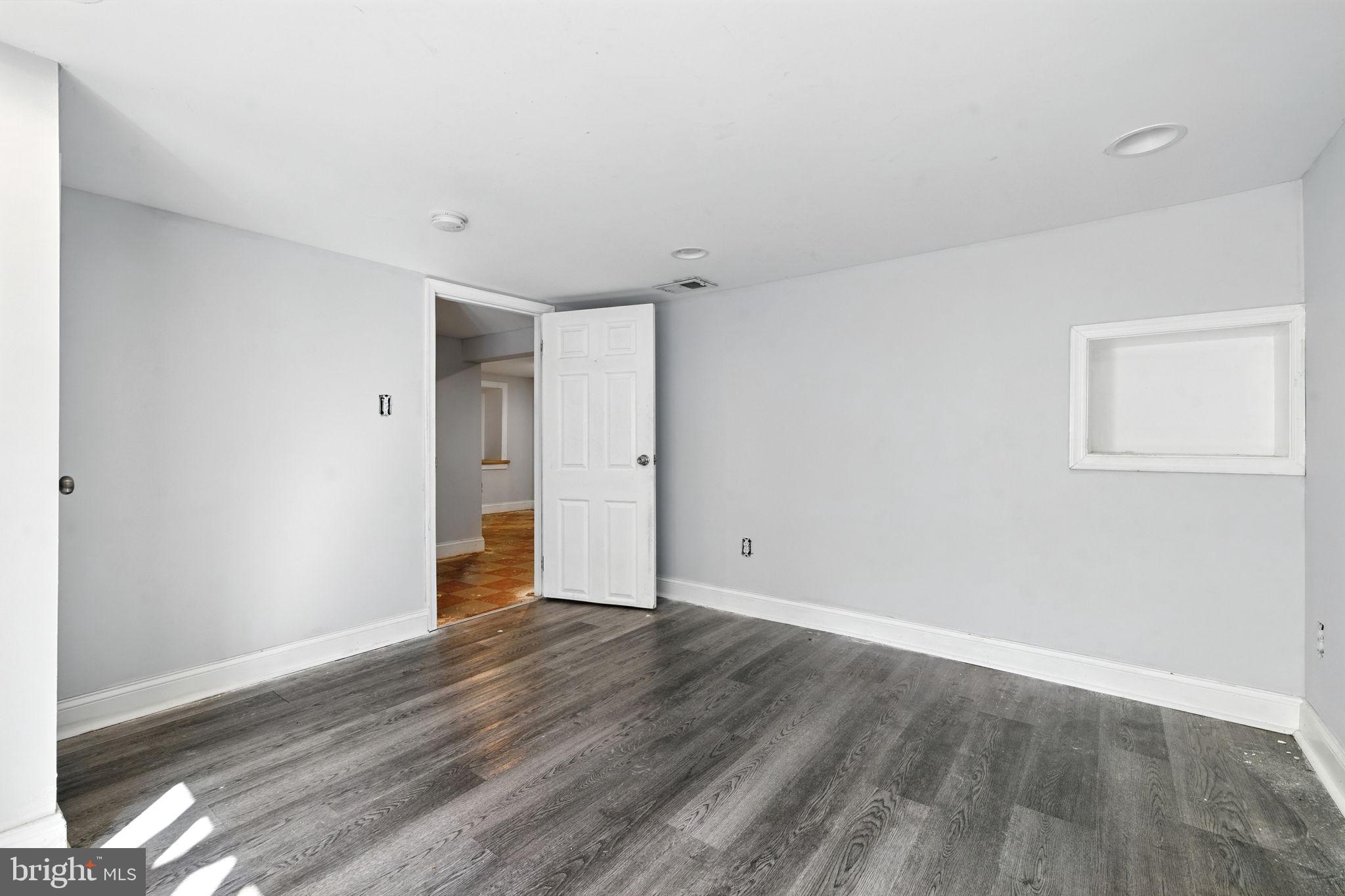 361 Savannah Road Baltimore, MD 21221 - Photo 21 of 30 a view of an empty room with wooden floor