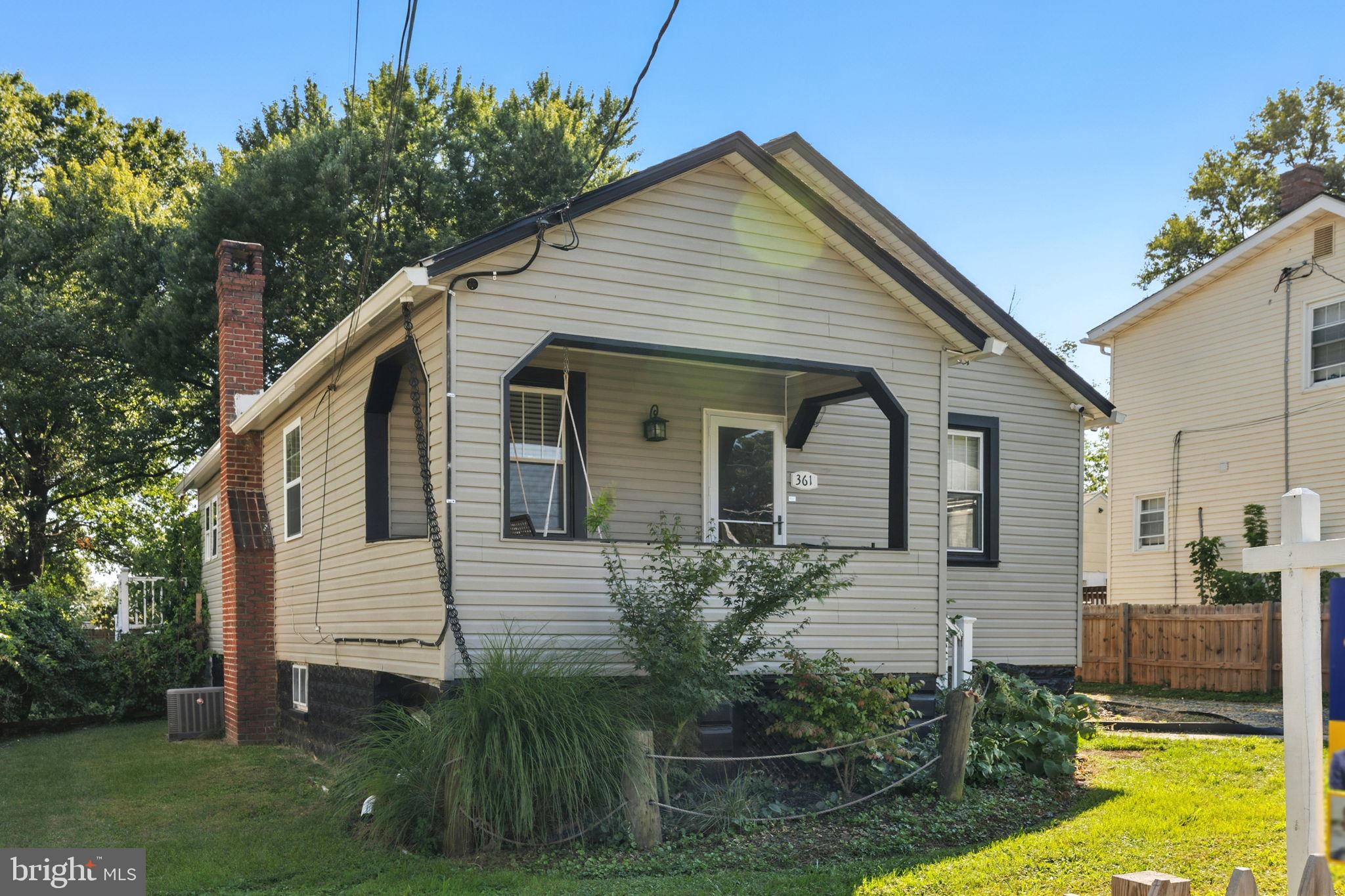 361 Savannah Road Baltimore, MD 21221 - Photo 3 of 30 a front view of a house with garden