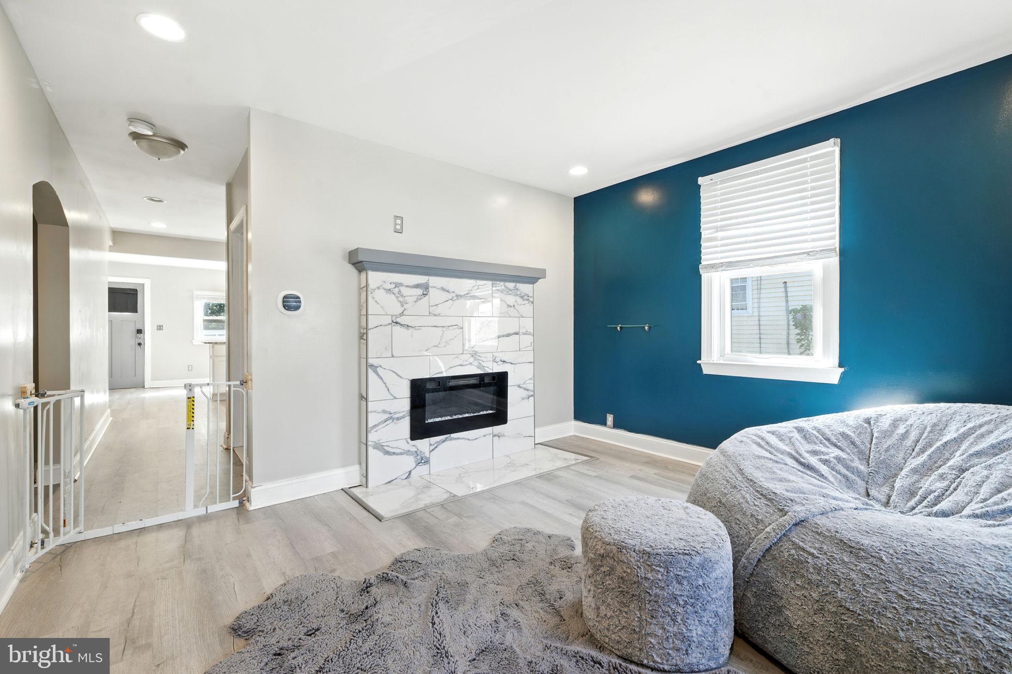 361 Savannah Road Baltimore, MD 21221 - Photo 4 of 30 a bedroom with a bed and a flat screen tv