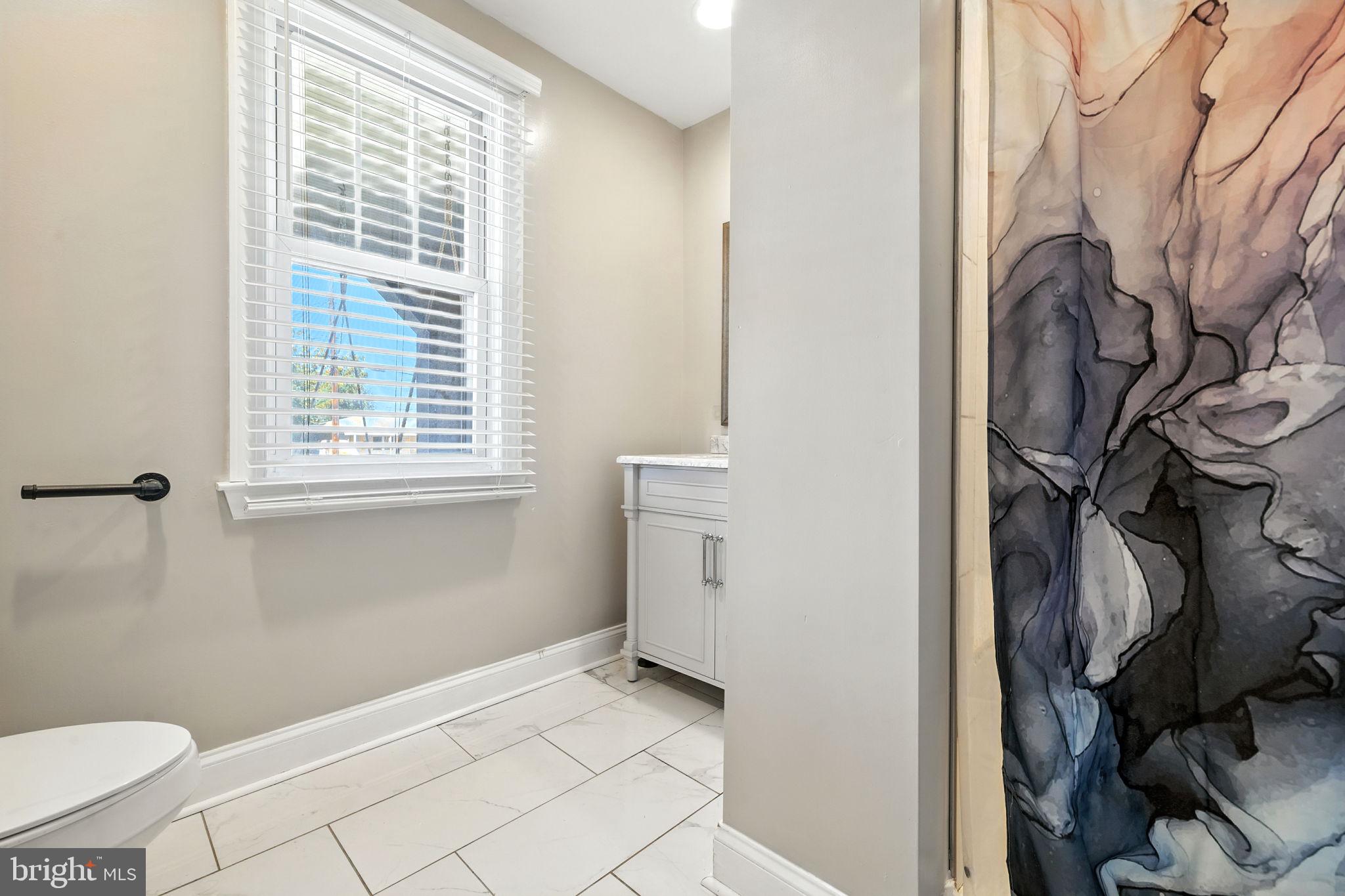 361 Savannah Road Baltimore, MD 21221 - Photo 8 of 30 a view of a storage & utility room with a window