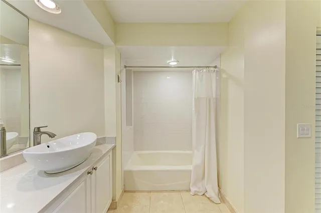 a view of a hallway with wooden floor and entryway