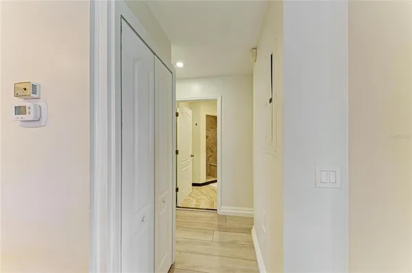 a bedroom with two large bed and a large window