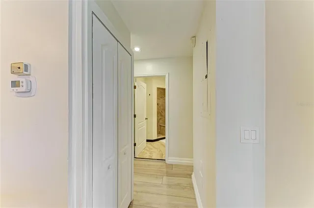 a bedroom with two large bed and a large window