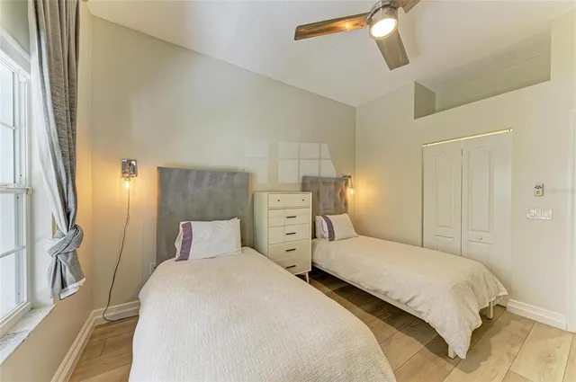 a kitchen with stainless steel appliances granite countertop a sink and a stove with wooden floor