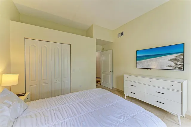 a view of a lake with a house in the background