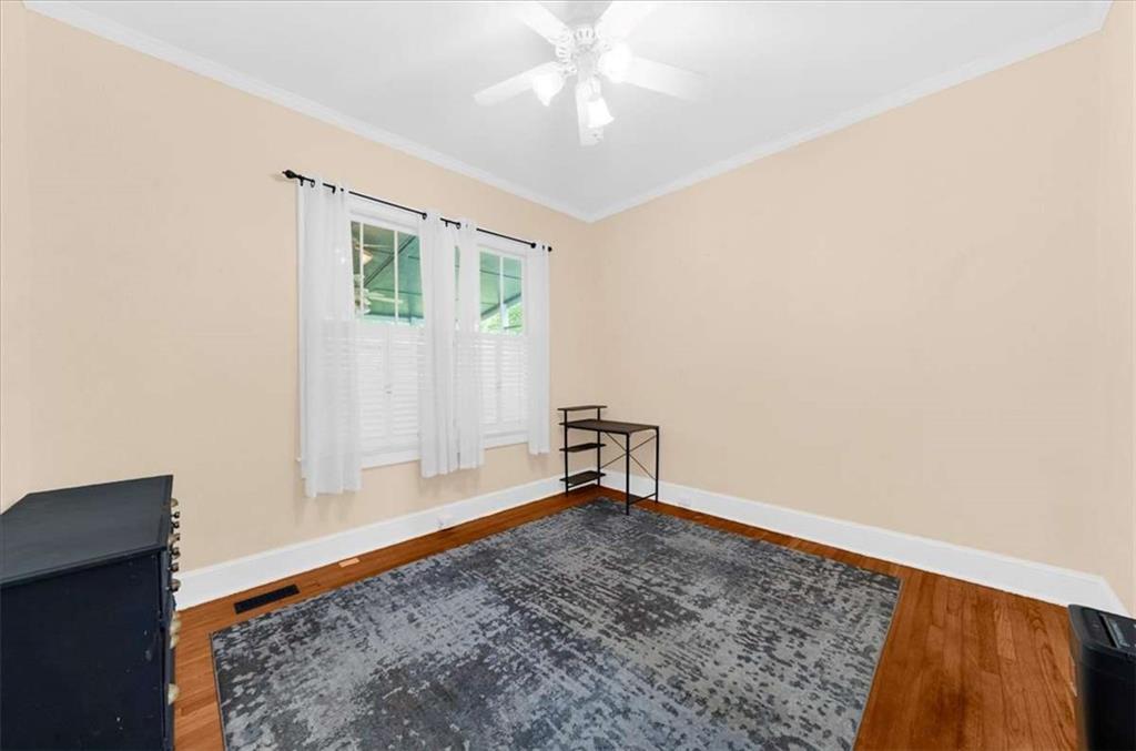 106 Westmore Road Southwest Rome, GA 30165 - Photo 31 of 56 an empty room with closet and a chandelier fan