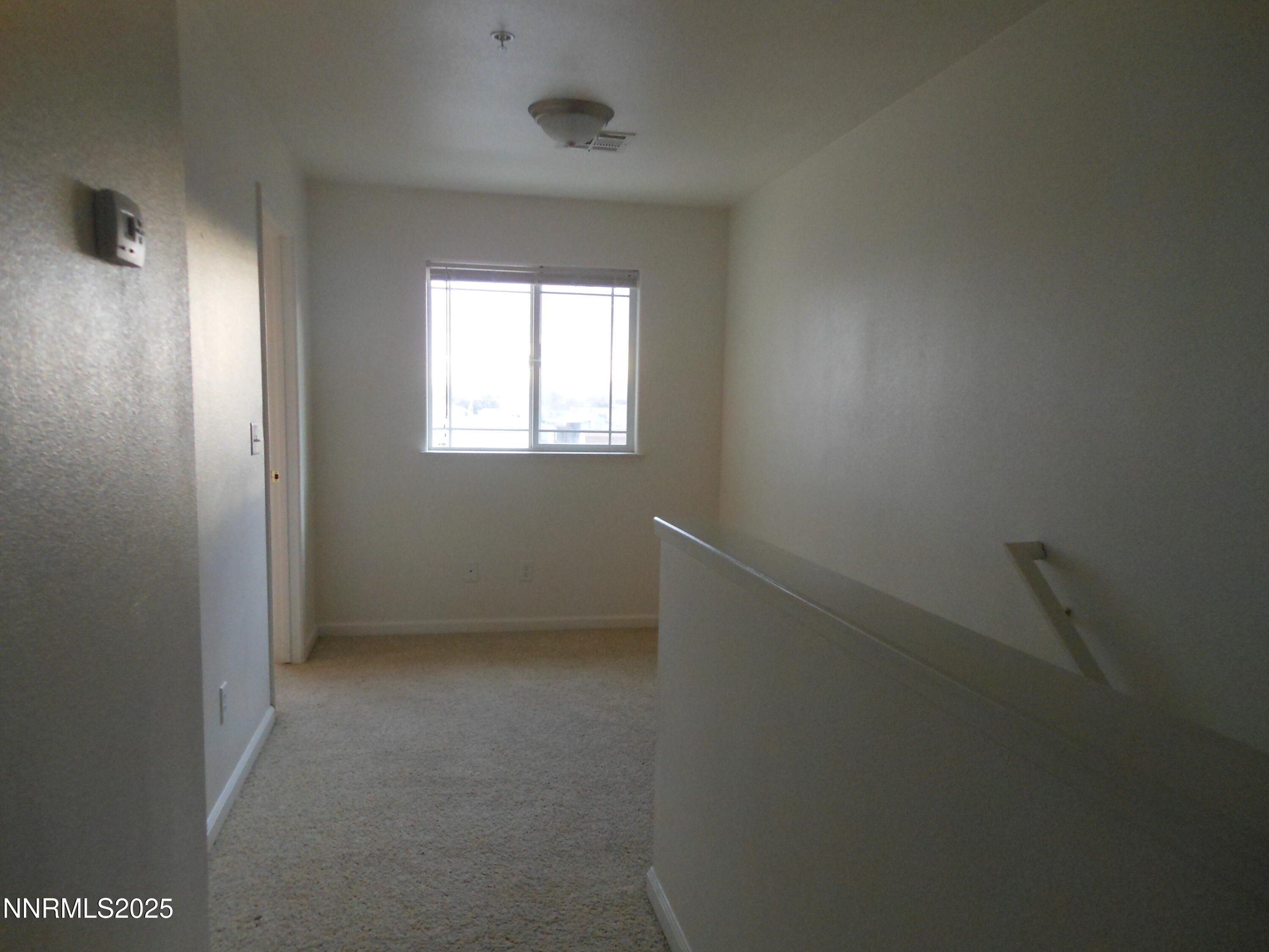 655 Desert Springs Court Fallon, NV 89406 - Photo 15 of 16 an empty room with a window