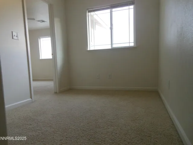 an empty room that has a window