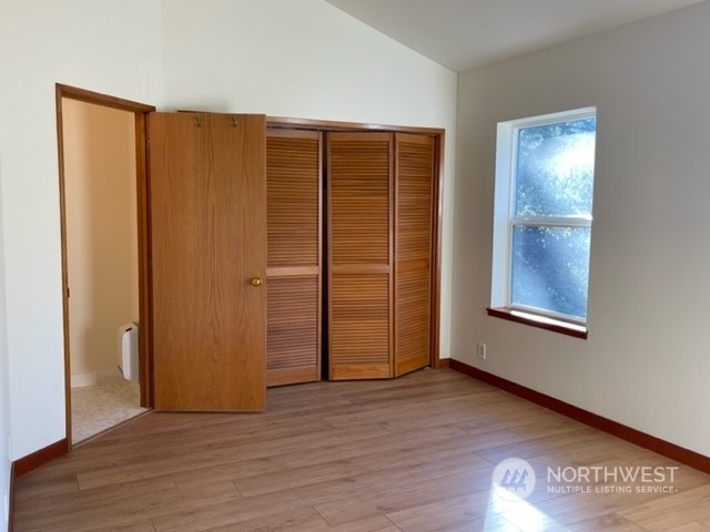 720 Guard Street, Unit 4 Friday Harbor, WA 98250 - Photo 13 of 19 an empty room with wooden floor and closet