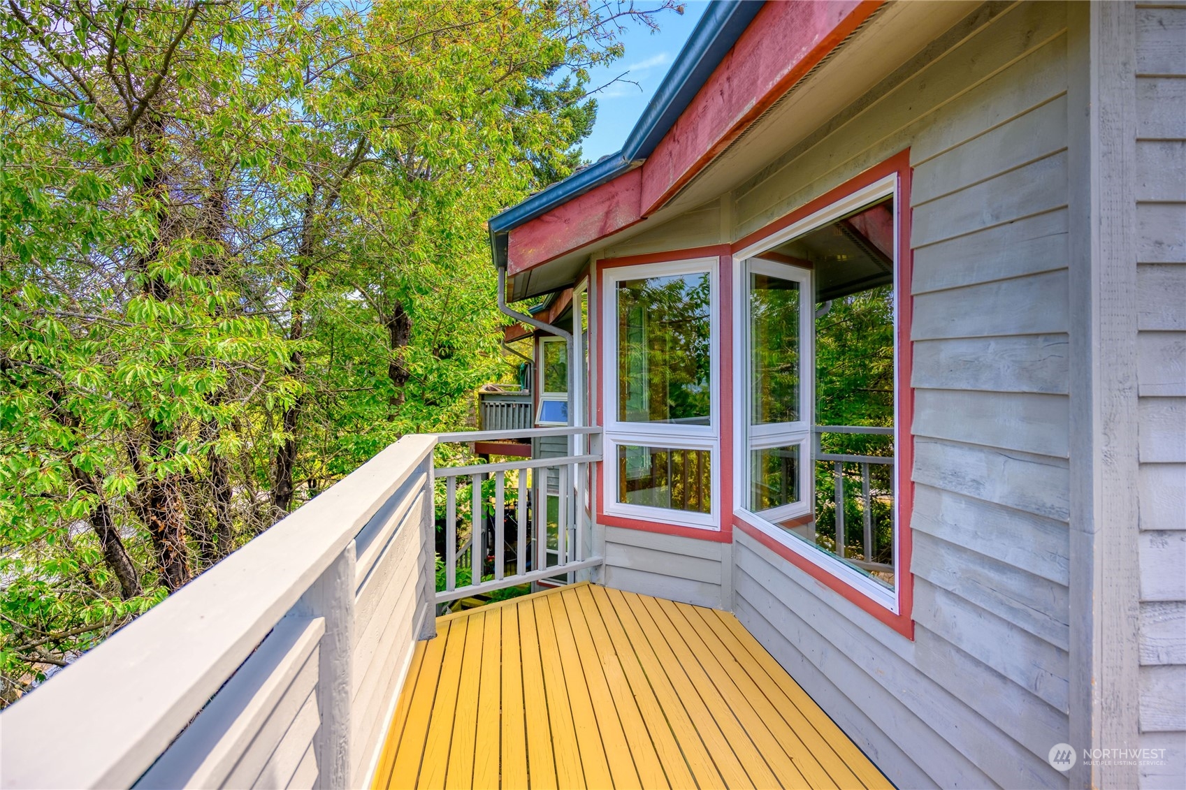 720 Guard Street, Unit 4 Friday Harbor, WA 98250 - Photo 18 of 19 a balcony with wooden floor and outdoor seating
