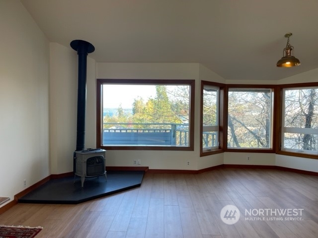 720 Guard Street, Unit 4 Friday Harbor, WA 98250 - Photo 2 of 19 a view of room with window and wooden floor