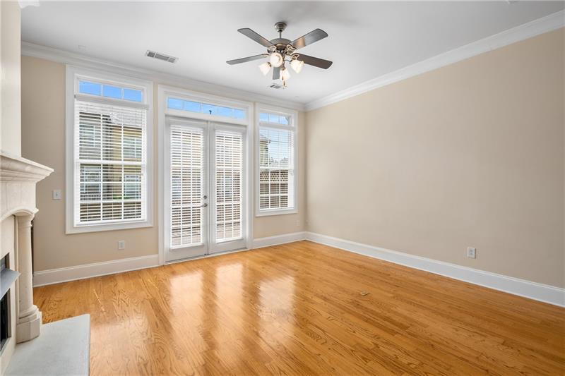 1420 Briarhaven Trail Atlanta, GA 30319 - Photo 9 of 29 a view of an empty room with a window and wooden floor