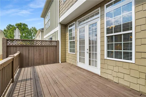 a view of a wooden deck with a yard