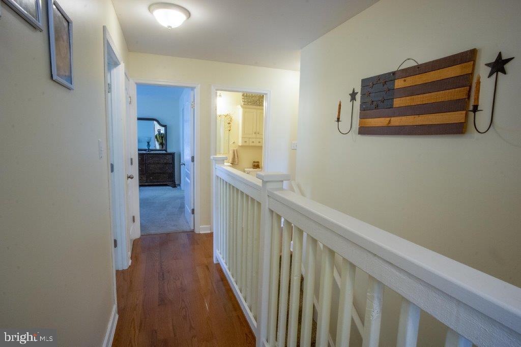 661 Stemmers Run Road Earleville, MD 21919 - Photo 13 of 42 Hallway leads to Bedrooms w/ Stairs to Family Room
