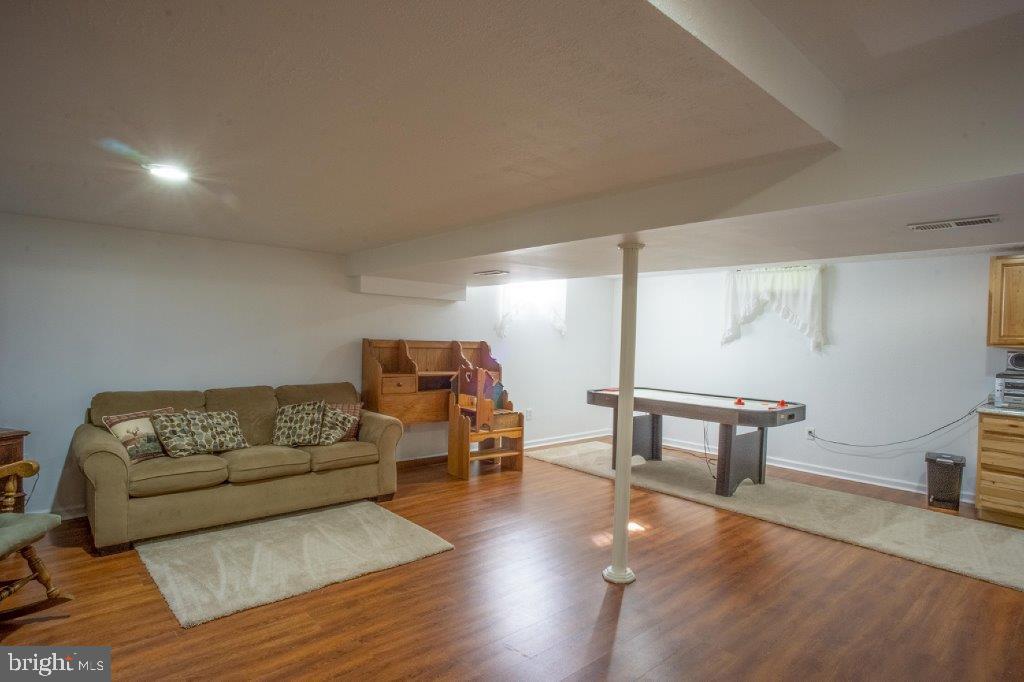 661 Stemmers Run Road Earleville, MD 21919 - Photo 24 of 42 Lower Level Family Room-Lovely Laminate Flooring