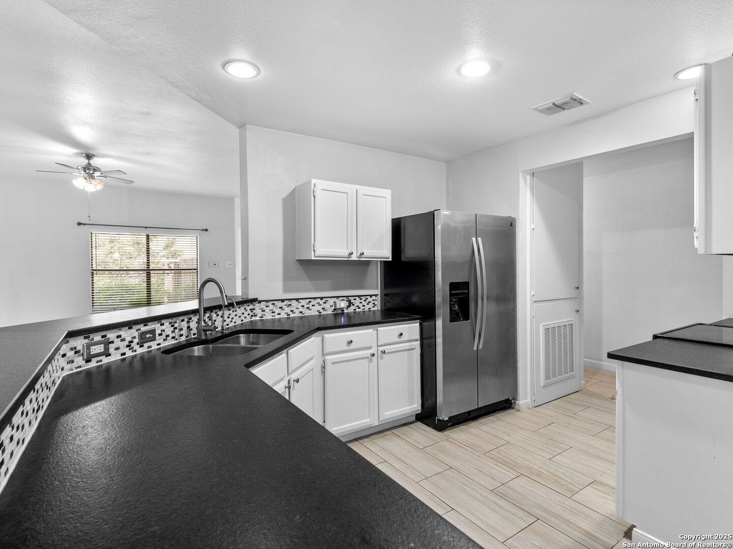 5430 Vista Court San Antonio, TX 78247 - Photo 15 of 37 a kitchen with a refrigerator and a sink
