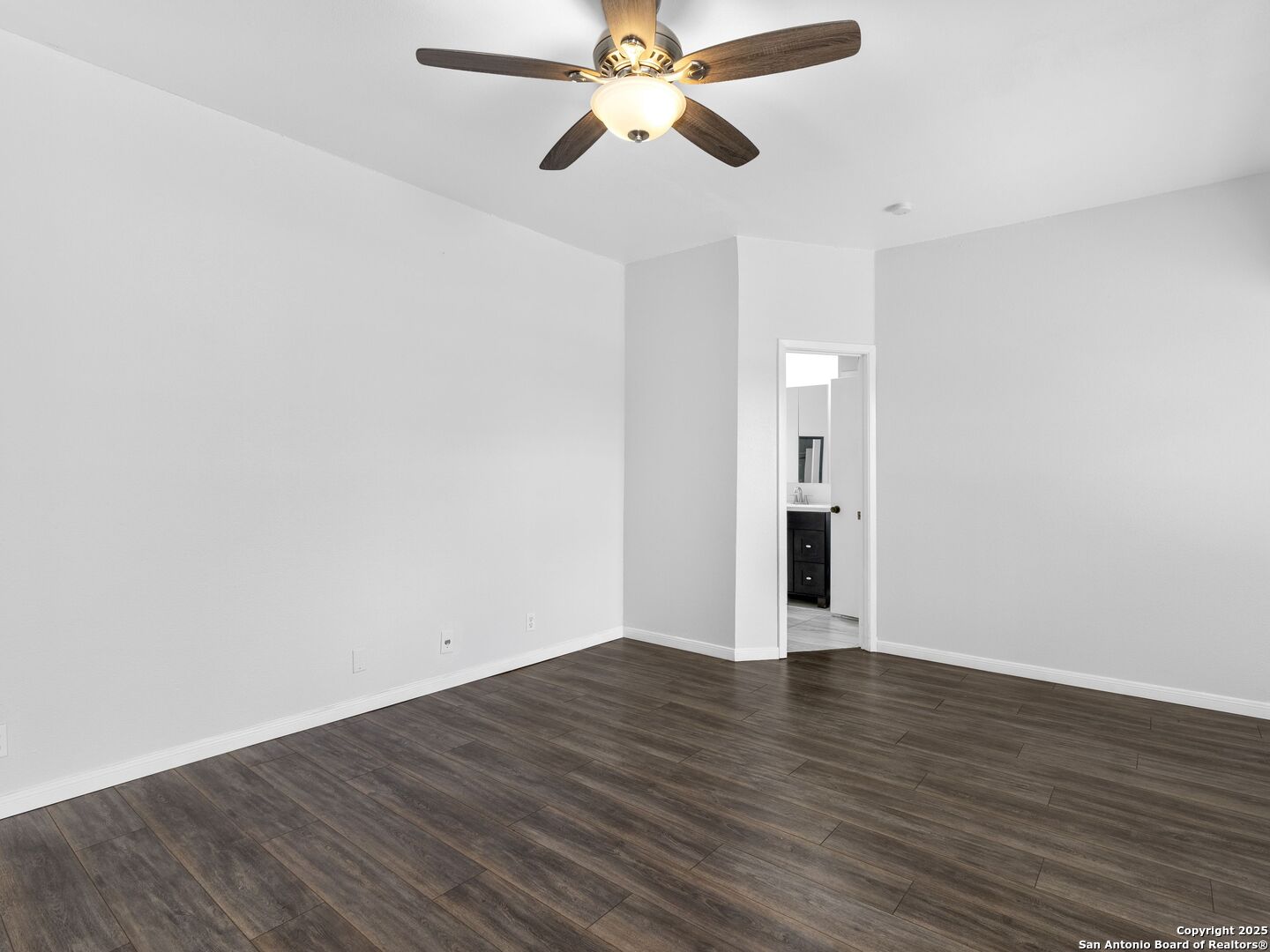 5430 Vista Court San Antonio, TX 78247 - Photo 22 of 37 a view of an empty room with window and wooden floor
