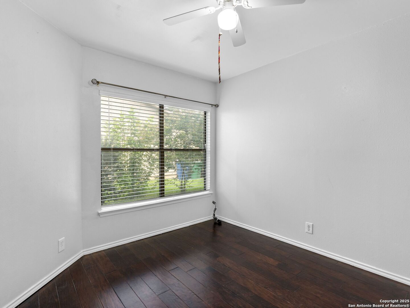 5430 Vista Court San Antonio, TX 78247 - Photo 29 of 37 an empty room with wooden floor fan and window