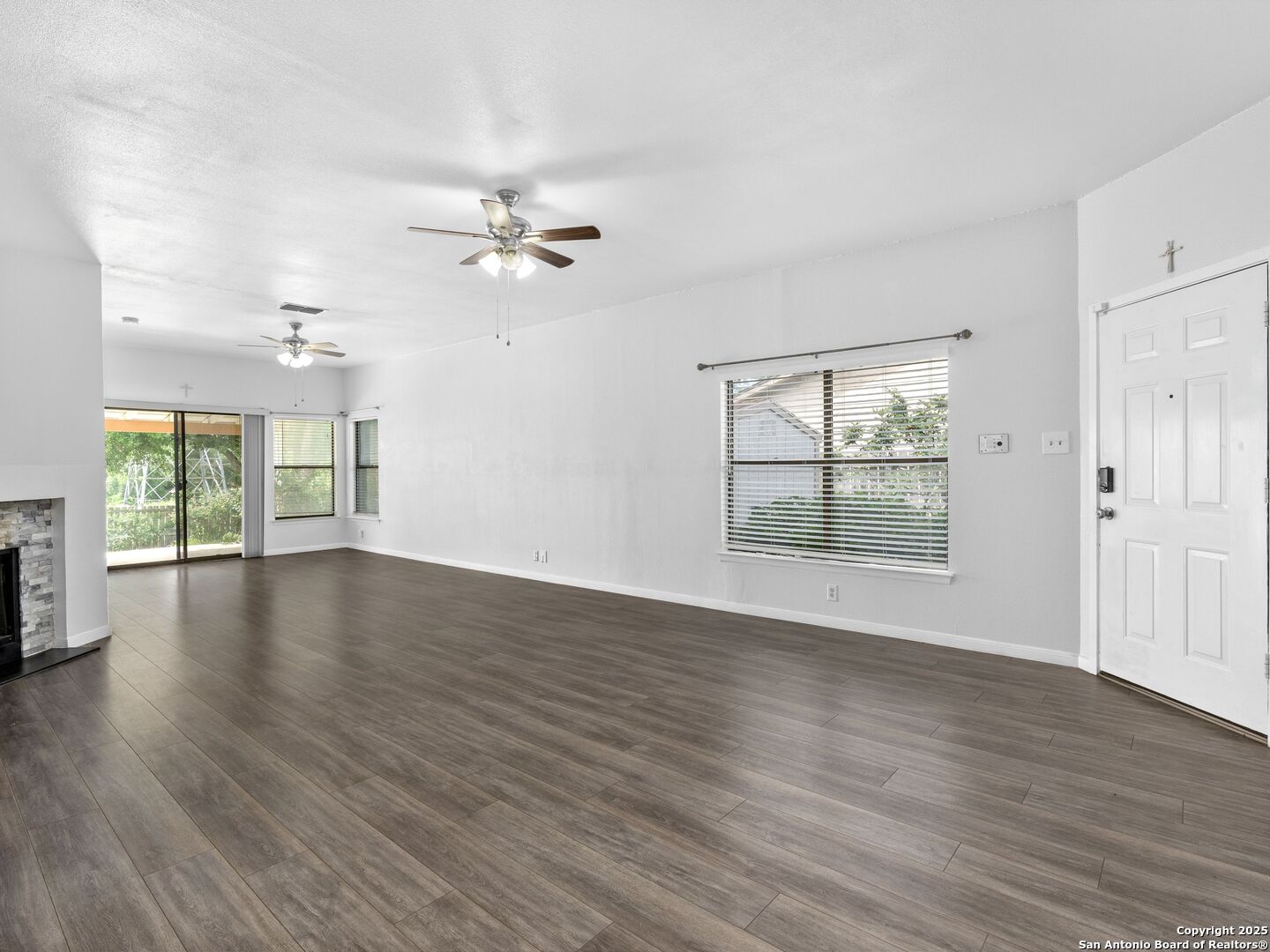 5430 Vista Court San Antonio, TX 78247 - Photo 3 of 37 a view of an empty room with wooden floor and a window