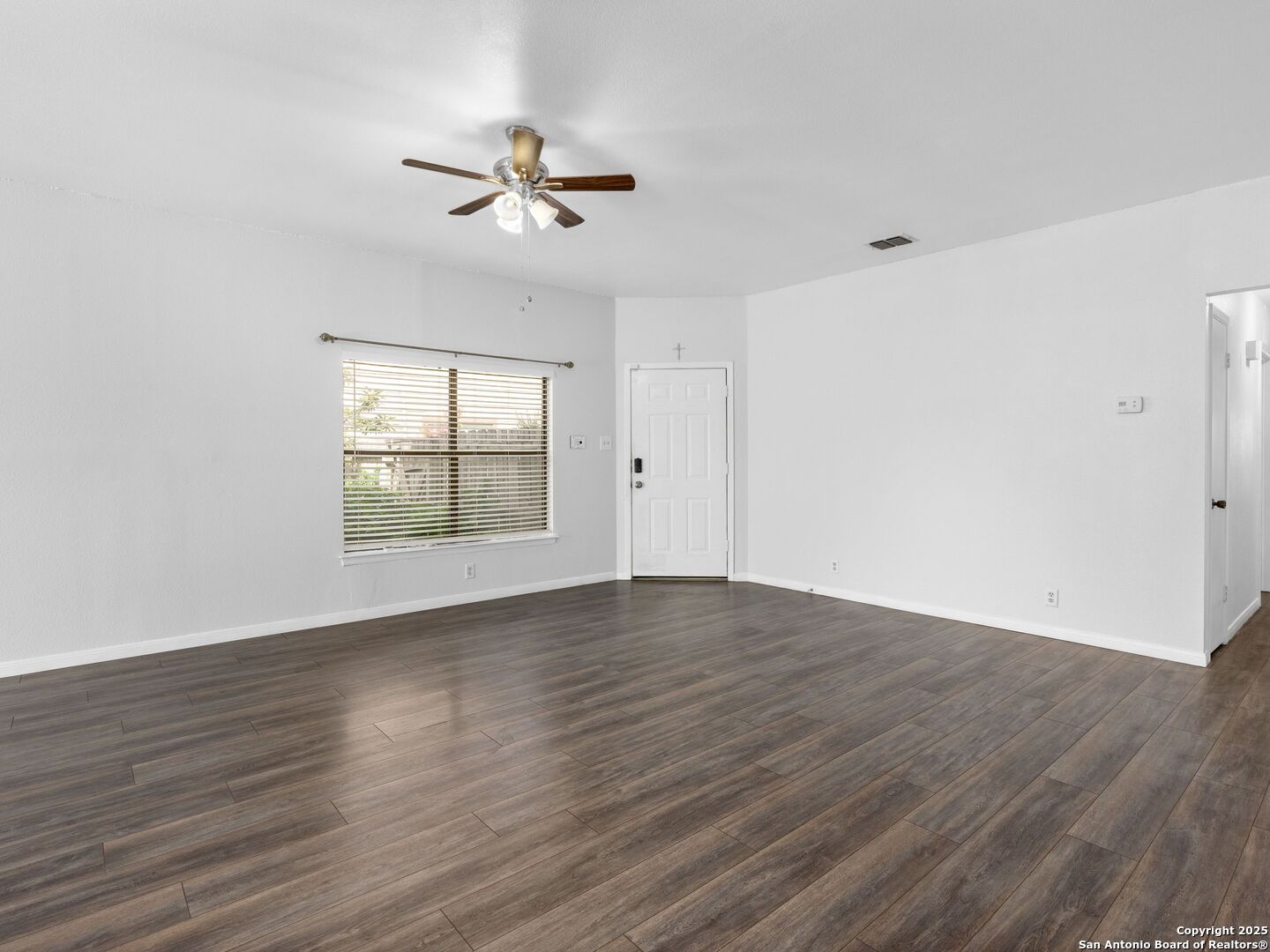 5430 Vista Court San Antonio, TX 78247 - Photo 4 of 37 a view of an empty room with wooden floor and a window