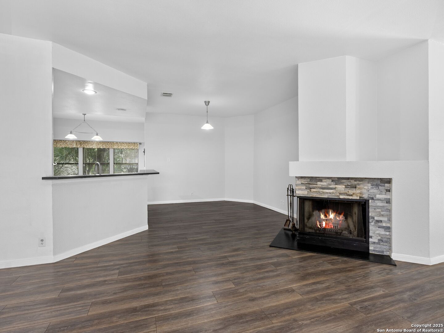 5430 Vista Court San Antonio, TX 78247 - Photo 8 of 37 a view of an empty room with wooden floor and fireplace