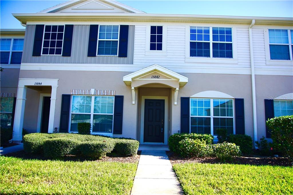 15842 Stable Run Drive Spring Hill, FL 34610 - Photo 1 of 1 a view of a brick house with plants and large tree