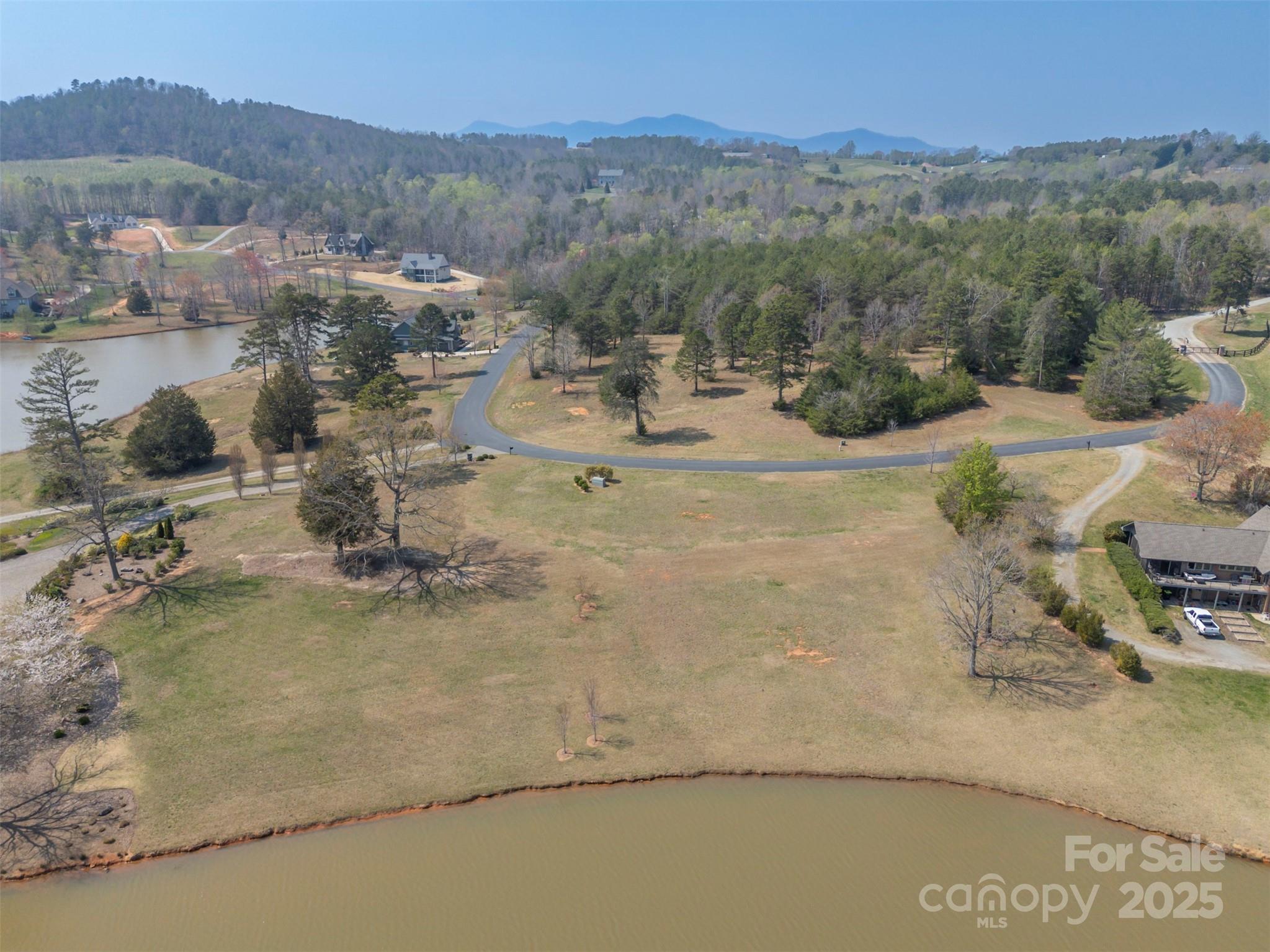 Lot 18 Mapleton Lane, Unit 18 Tryon, NC 28782 - Photo 19 of 30 a view of a town with mountains in the background