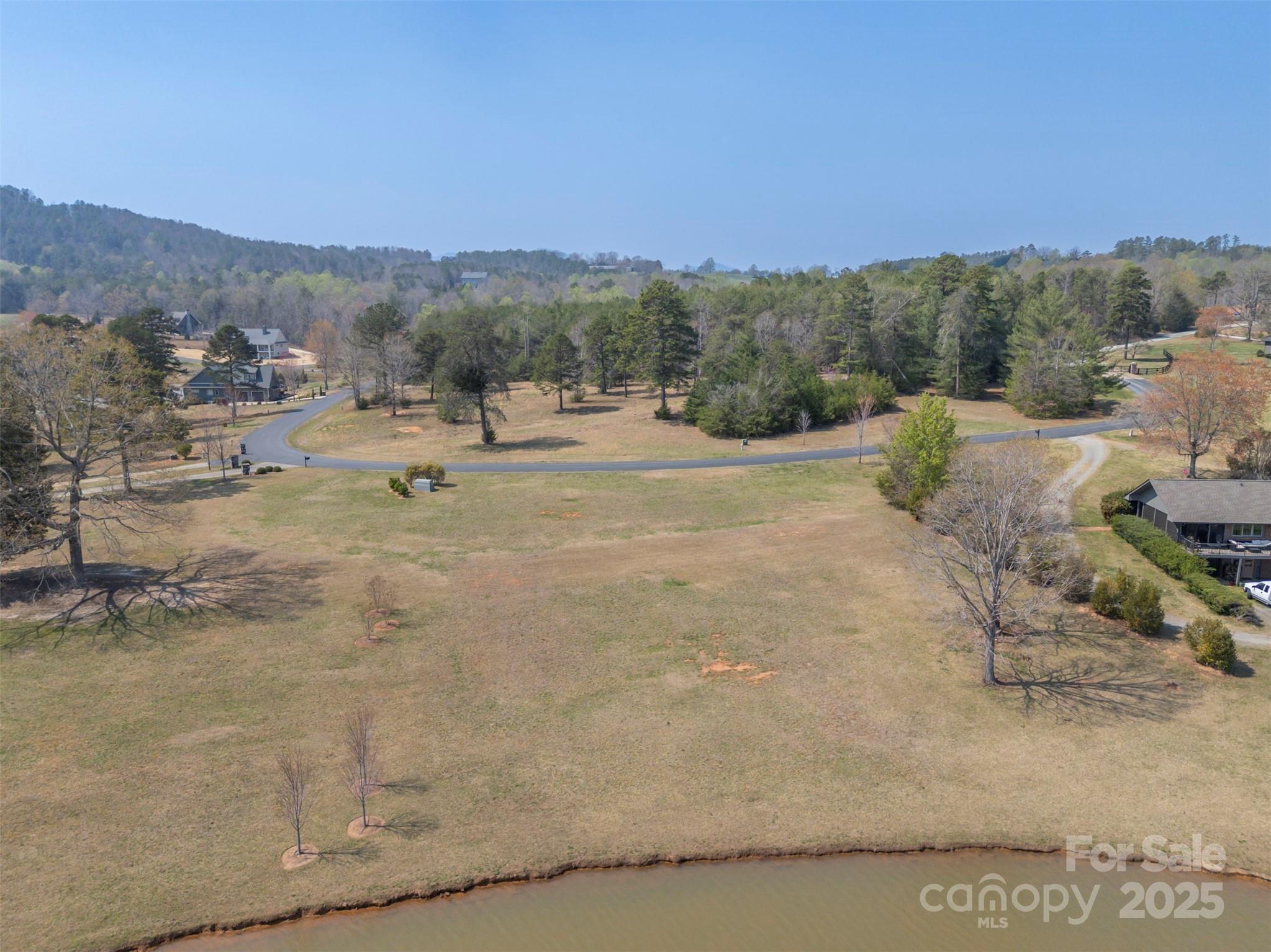 Lot 18 Mapleton Lane, Unit 18 Tryon, NC 28782 - Photo 20 of 30 a view of a town with mountains in the background