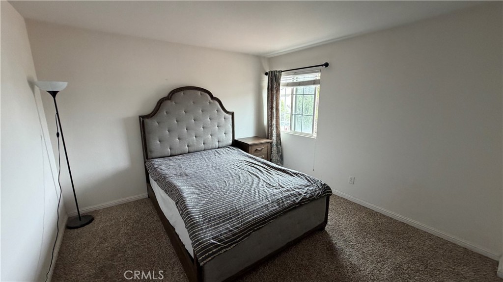 7134 Cumberland Place Rancho Cucamonga, CA 91739 - Photo 16 of 22 a bed sitting in a bedroom next to a window