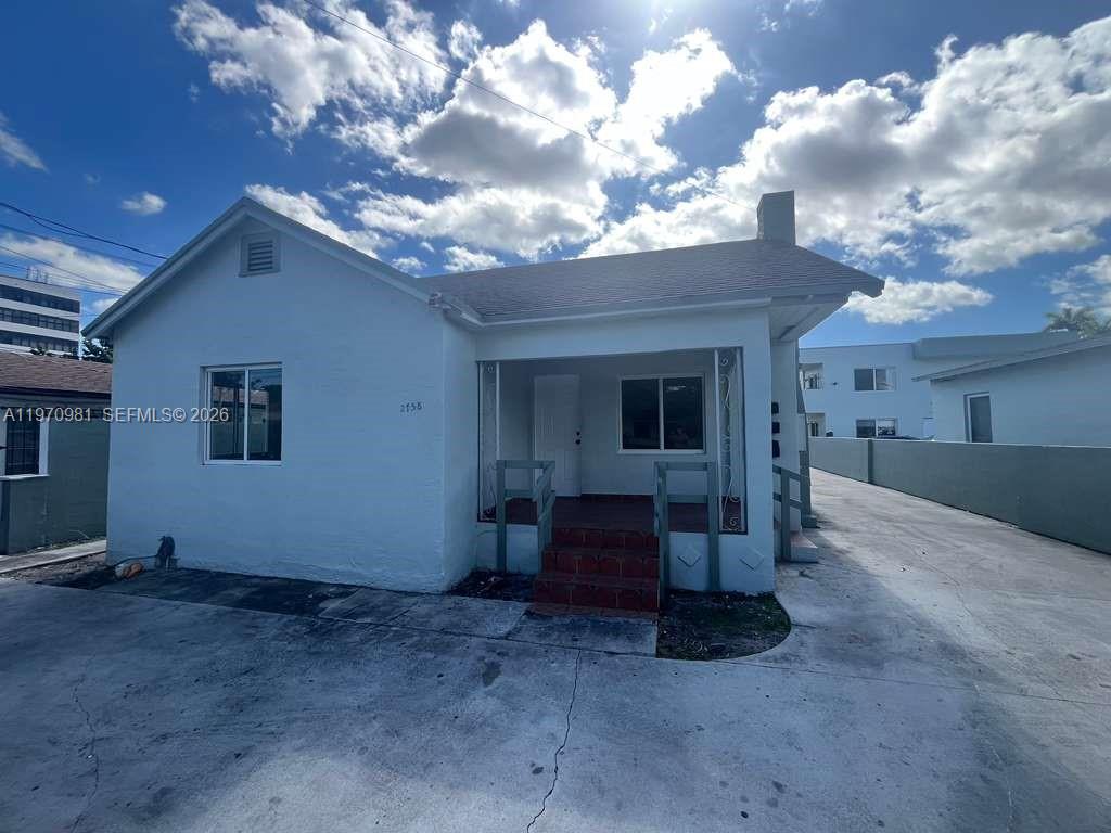 2758 Southwest 3rd Street Miami, FL 33135 - Photo 1 of 19 a view of a house with a large tree