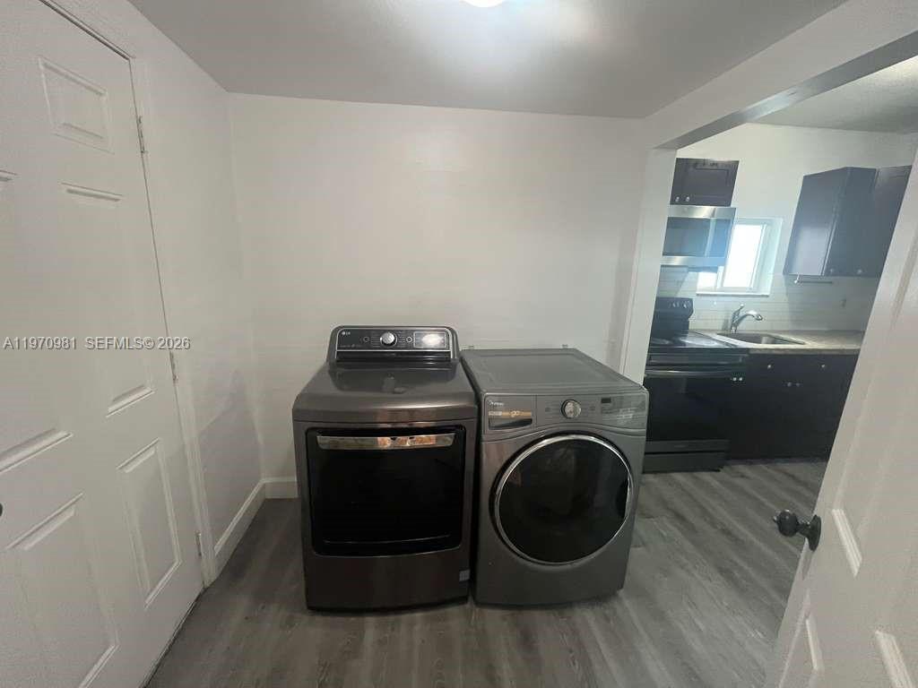 2758 Southwest 3rd Street Miami, FL 33135 - Photo 19 of 19 a utility room with dryer and washer