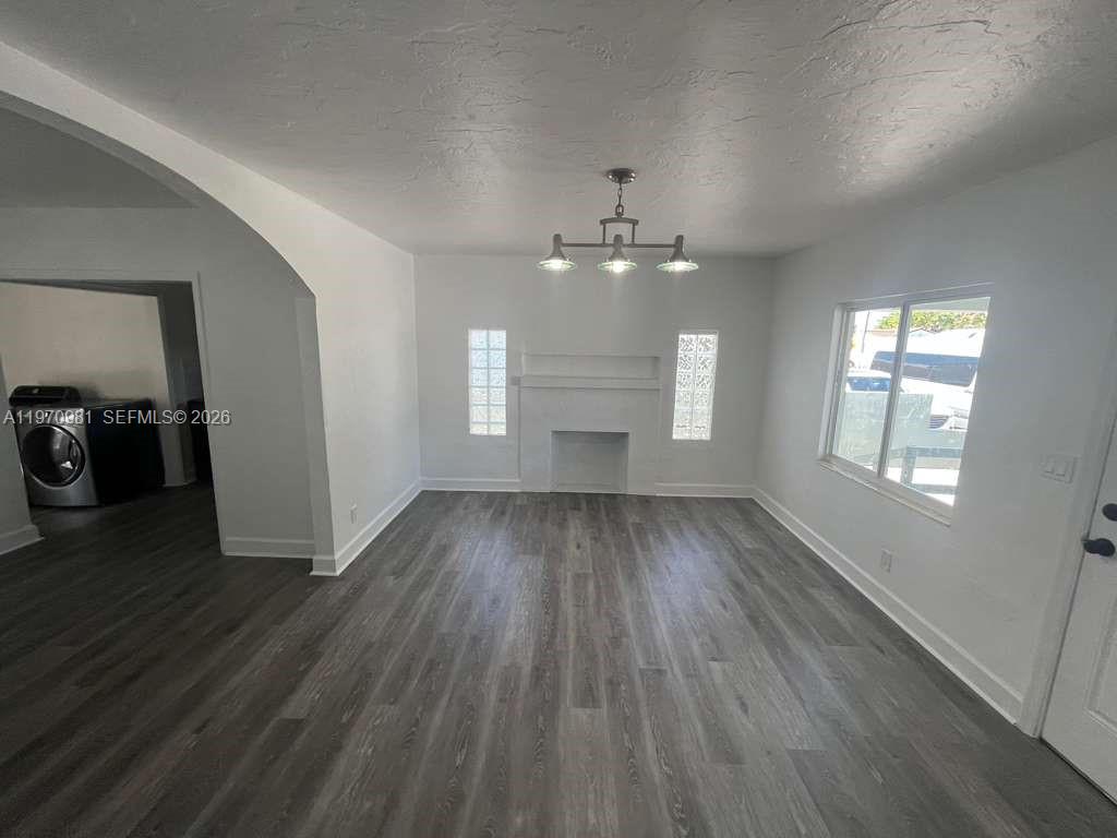 2758 Southwest 3rd Street Miami, FL 33135 - Photo 3 of 19 wooden floor in an empty room with a window