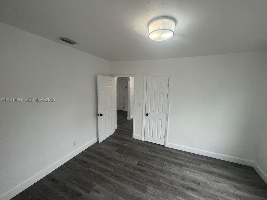 2758 Southwest 3rd Street Miami, FL 33135 - Photo 5 of 19 a view of a room with wooden floor and window