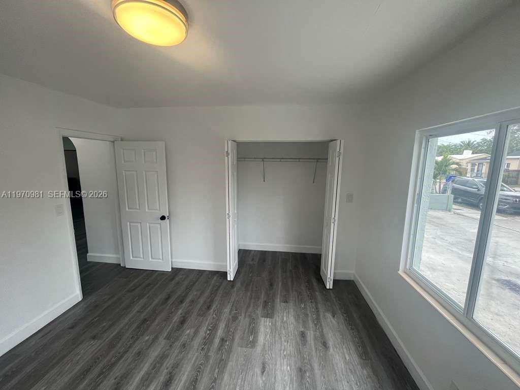 2758 Southwest 3rd Street Miami, FL 33135 - Photo 8 of 19 a view of room with window and wooden floor