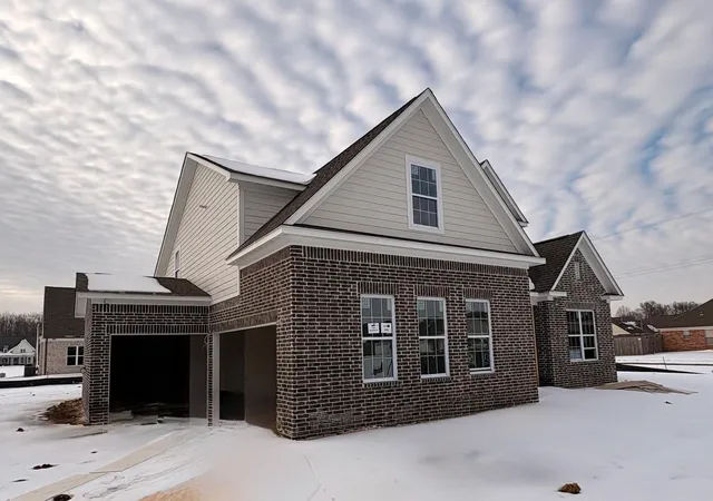 a front view of a house with a garage