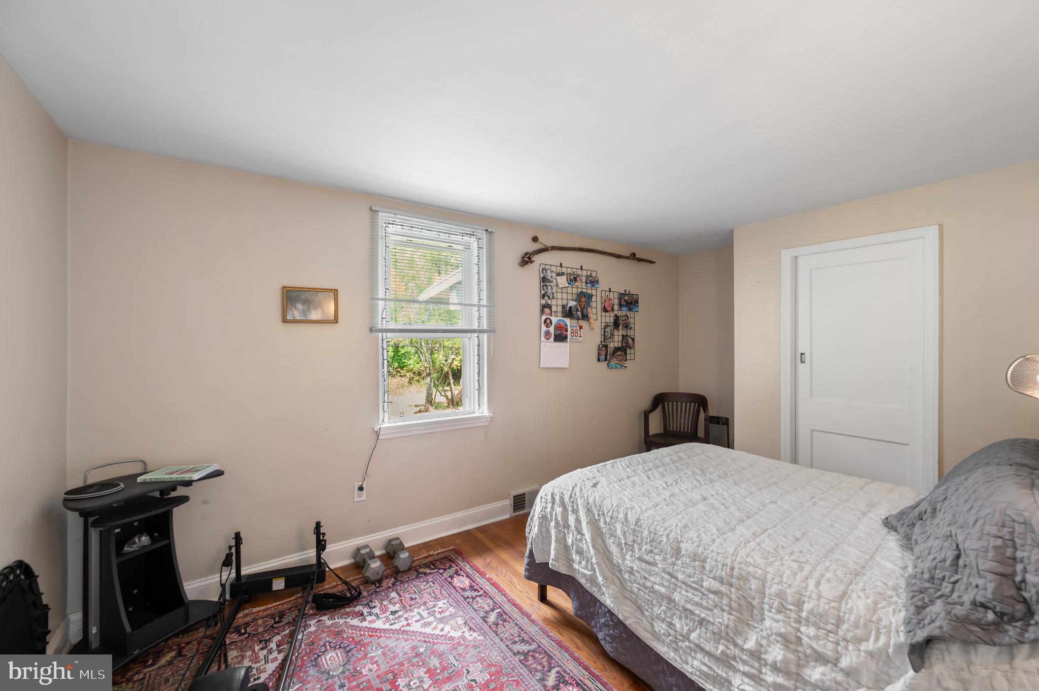 120 Diamond Rock Road Phoenixville, PA 19460 - Photo 49 of 86 a bedroom with a bed and wooden floor