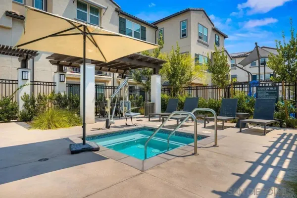 a view of a chairs and table in the patio