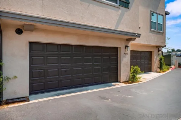 a view of a wooden door and a window